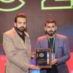 Aziz Ur Rehman receiving Excellence Award at Connected Pakistan Conference 2024 for top freelancer achievement
